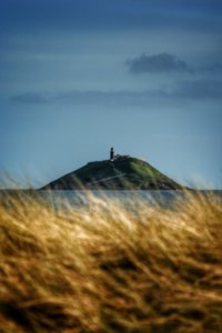 Ballycotton Island and lighthouse glimpsed through the dunes | SHORTLISTED | Photographer: Matt Brooker